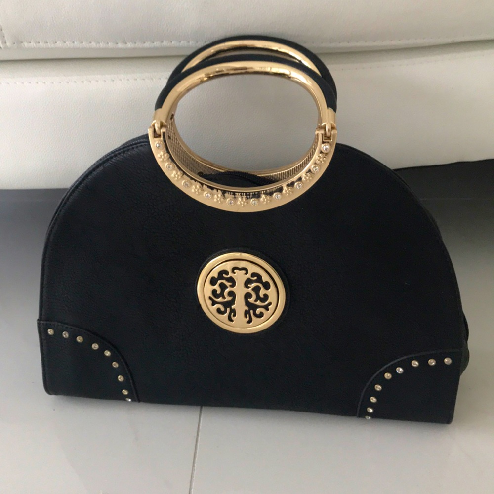 Black and gold handbag with shoulder strap